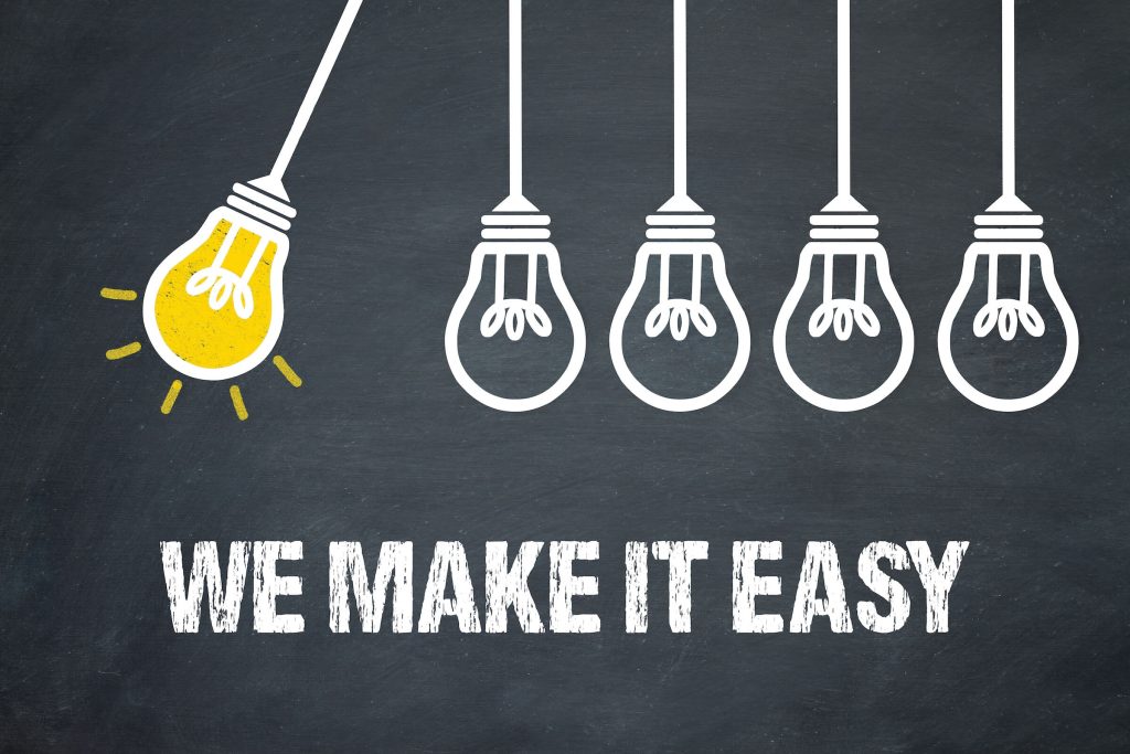 chalkboard concept of light bulbs with the words We Make It Easy