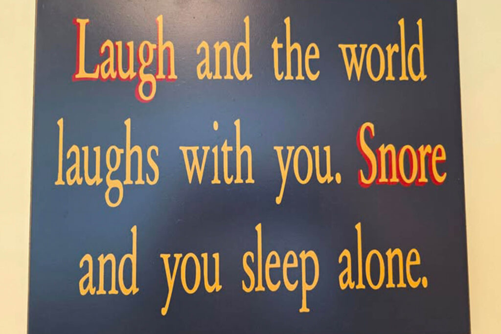 This image includes a funny quote about laughter bringing people together.