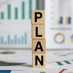 wooden blocks spelling the word "Plan"