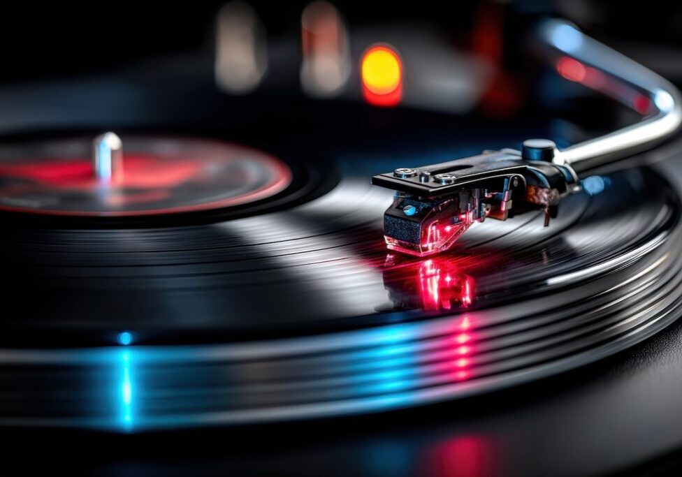 This image shows a stereo turntable with a black vinyl record being played.